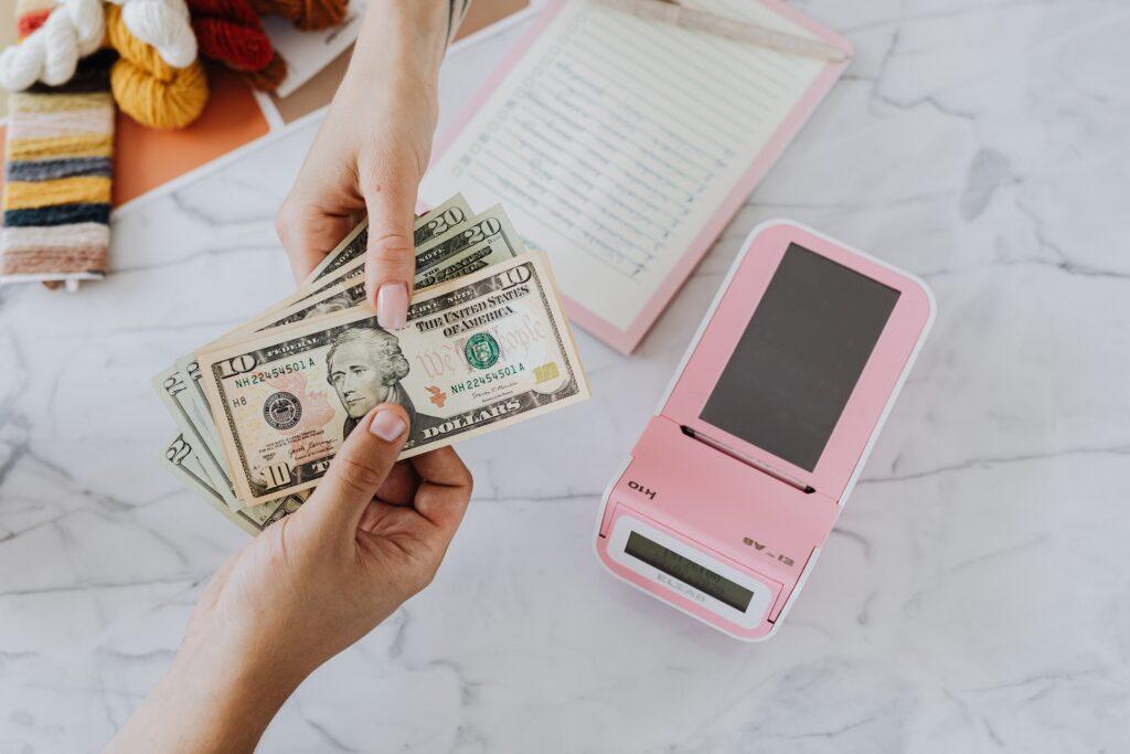 People exchanging money over a table