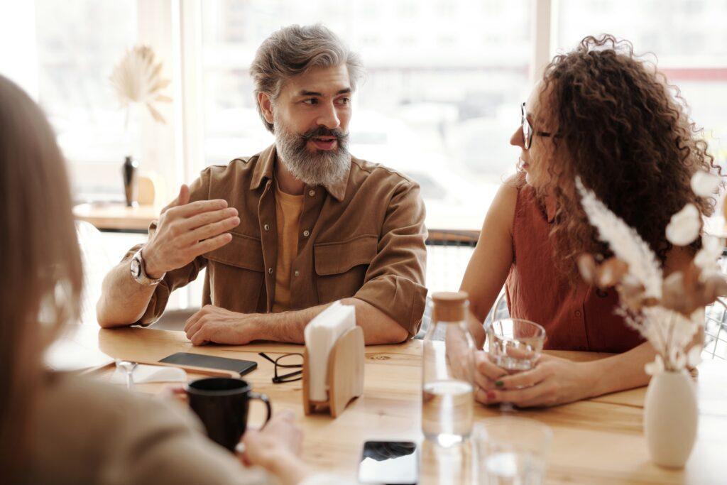 People talking on a table