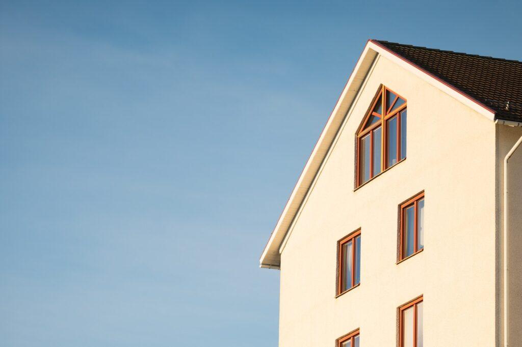 beige concrete house under blue sky