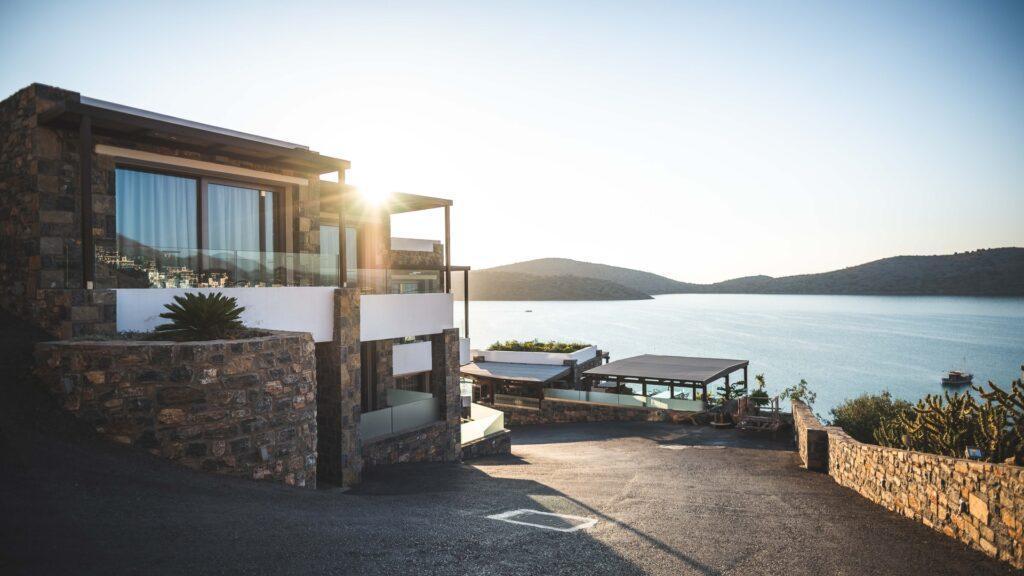 brown concrete house near sea